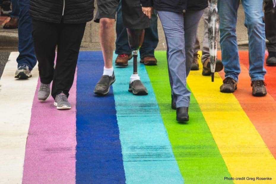 Community or people crossing a rainbow road